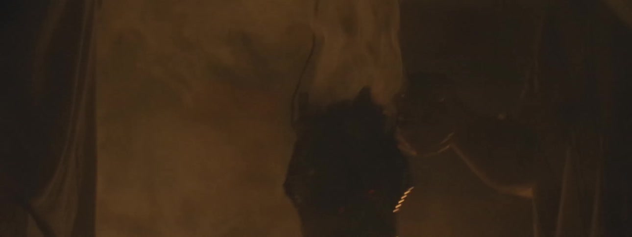 A smoking censer swings gently in a dark, candlelit room during a mysterious ancient ritual