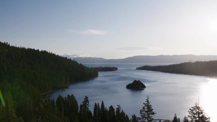 A slow pan reveals the stunning panoramic view of Lake Tahoe's Emerald Bay and Fannette Island at sunrise