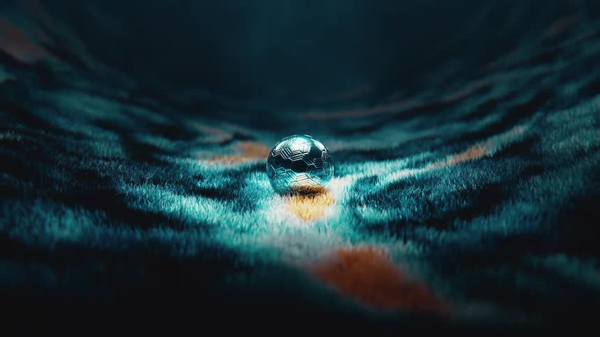 A futuristic chrome soccer ball lands gently on a surreal and colorful furry landscape
