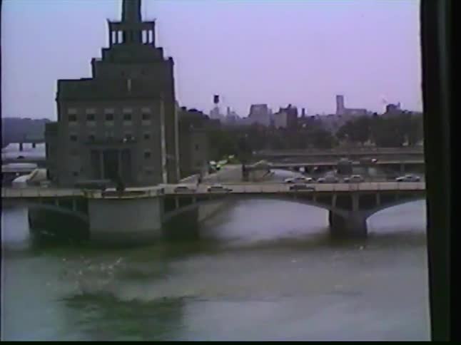 A point-of-view perspective from a truck driving on the highway through Cedar Rapids, Iowa, passing the Quaker Oats factory and crossing a bridge in the 1980s