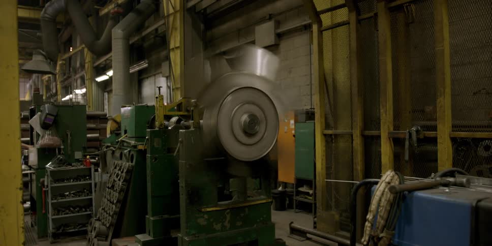 A fan rotates in a warehouse