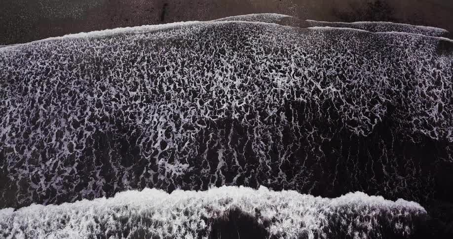 Ocean water flowing up onto beach