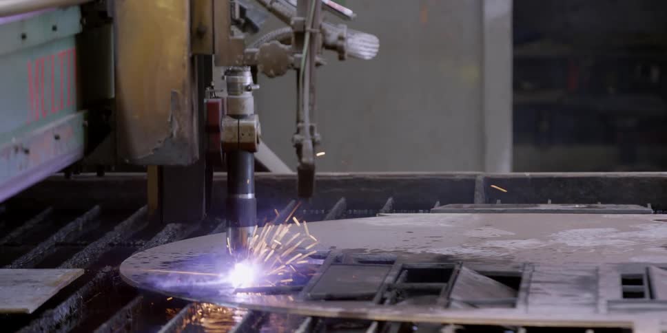 A laser welder is cutting a sheet of metal