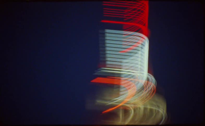 An abstract, experimental film captures the vibrant light trails of the Empire State Building and city traffic at night