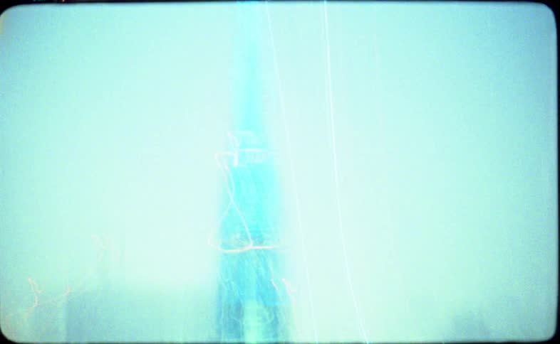 Vintage 16mm film captures chaotic and abstract city light trails at night