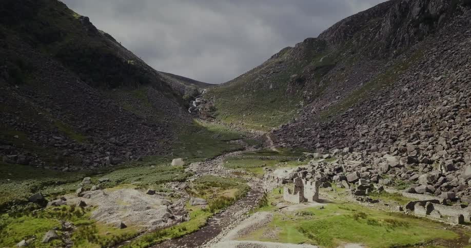 Sunshine moves across a rocky valley