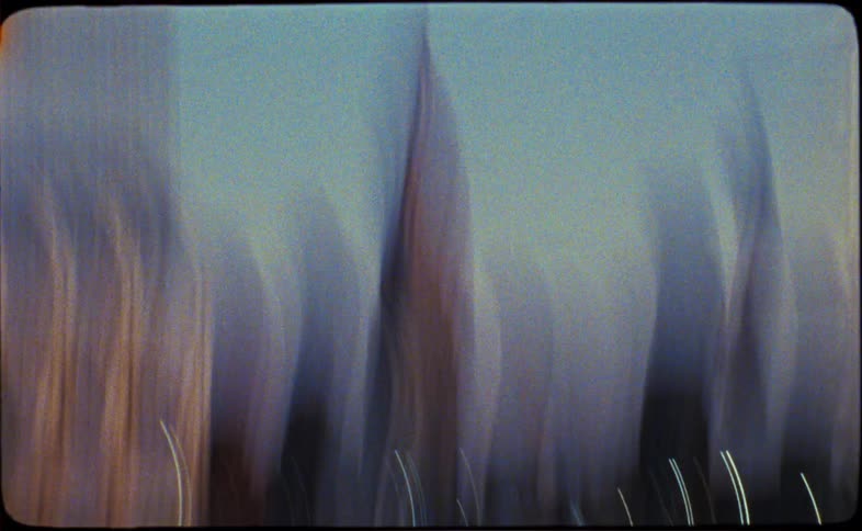 An abstract and experimental montage of New York City captures the frantic energy of urban life through motion blur and light trails on vintage film