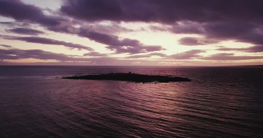 A small island is below at dawn