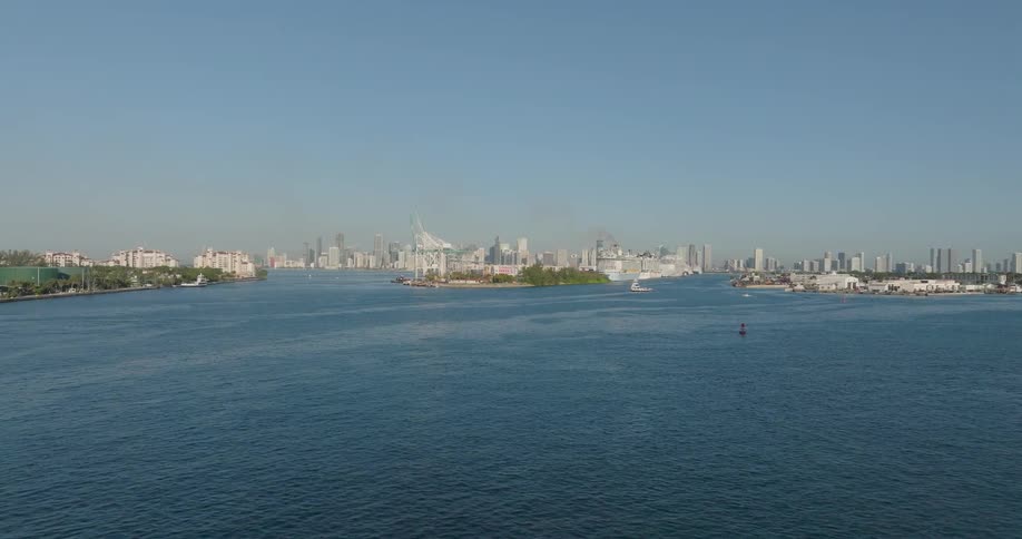 A scenic wide shot of the Port of Miami and the downtown skyline on a clear, sunny day