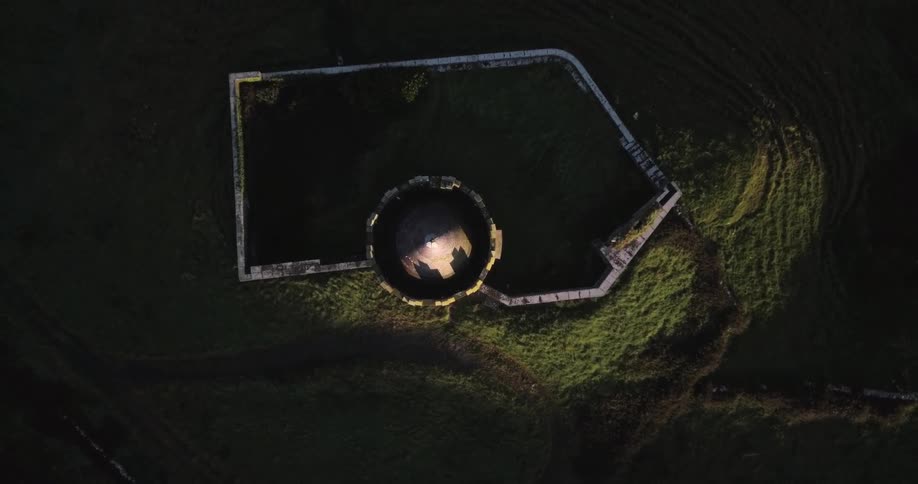 A tower has a courtyard surrounded by a wall
