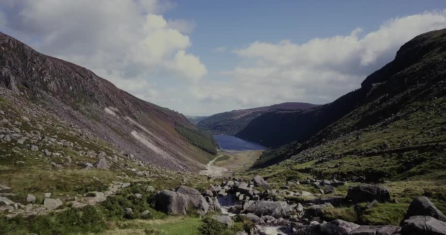 A rocky mountain valley is shown