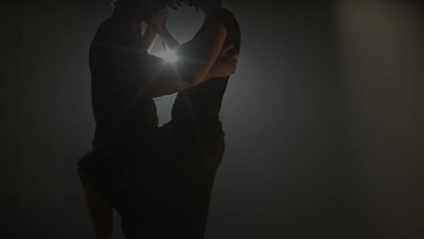Two dancers in a spotlight