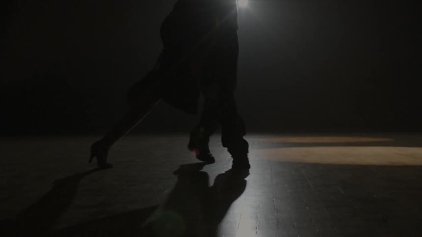 A man and woman are dancing together
