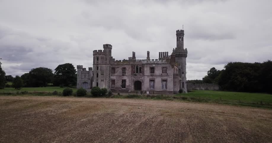 An old castle is shown on a cloudy day