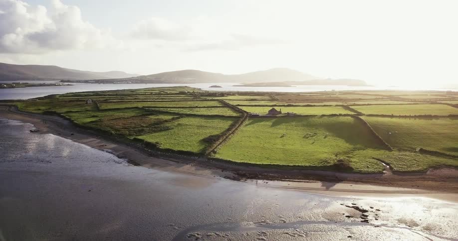 Water splashes against the green fields ahead