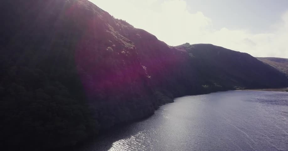 The tall mountain has a lake on it's side