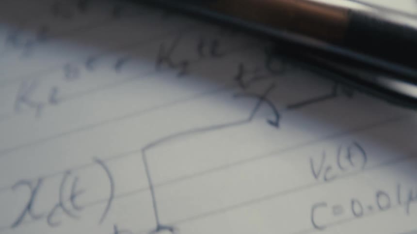 A macro shot pans across handwritten notes and diagrams for a complex physics or electrical engineering problem