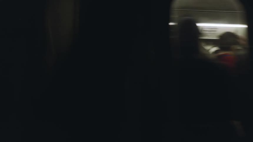 Passengers ride a subway train