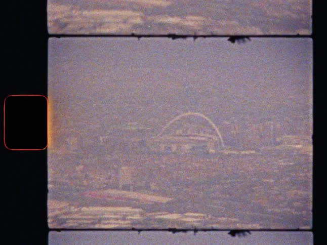 Aerial view of Wembley Stadium through hazy clouds on vintage super 8 film