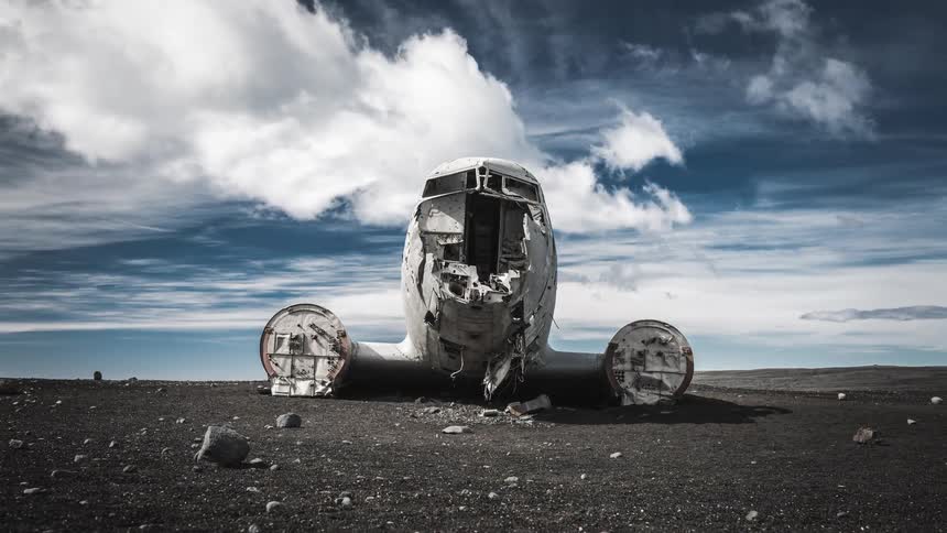 A dramatic time-lapse of clouds passing over the famous DC-3 plane wreck abandoned on the desolate black sand beach of Sólheimasandur in Iceland