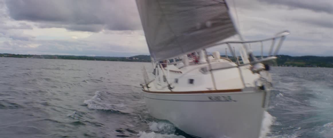 A large white boat is sailing in the water