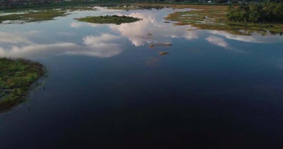 The water is very calm and reflective
