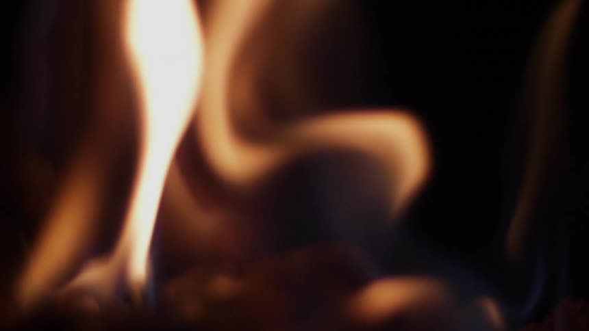 A fire burns at night