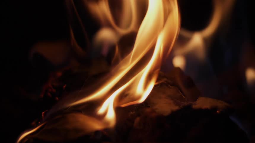 Fire burning on wood at night