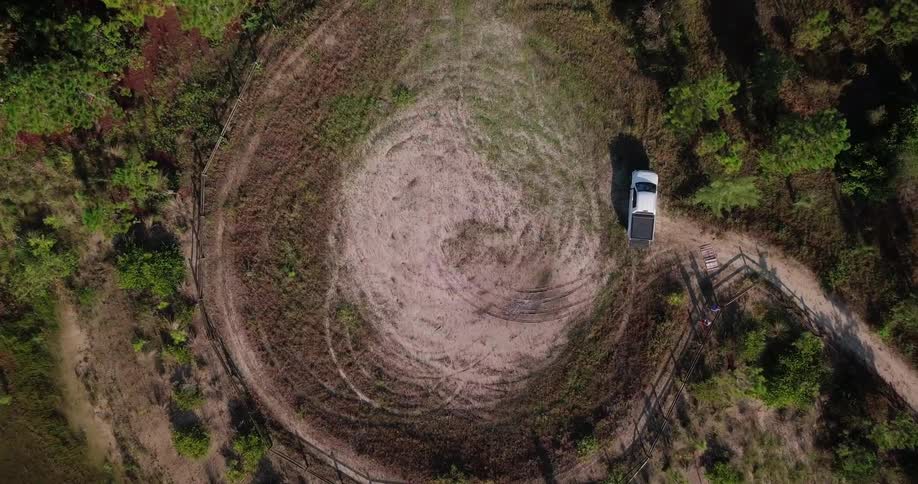 A truck is parked in a rural area