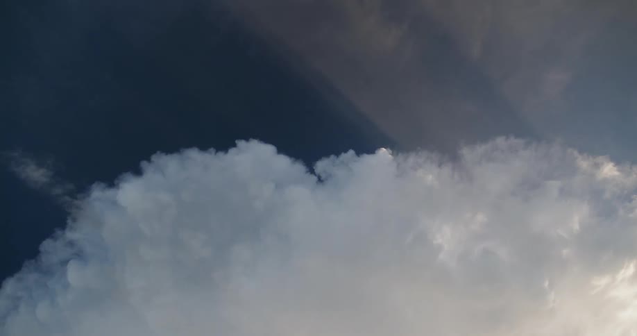 White clouds pass overhead
