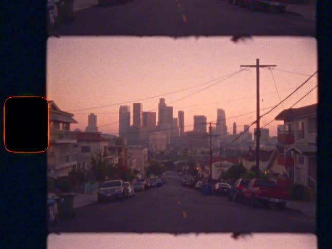 Iconic Los Angeles skyline at sunset, on Super 8 film