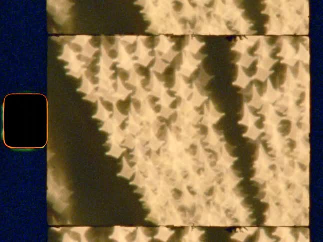 Abstract, shimmering neon lights on Super 8 film