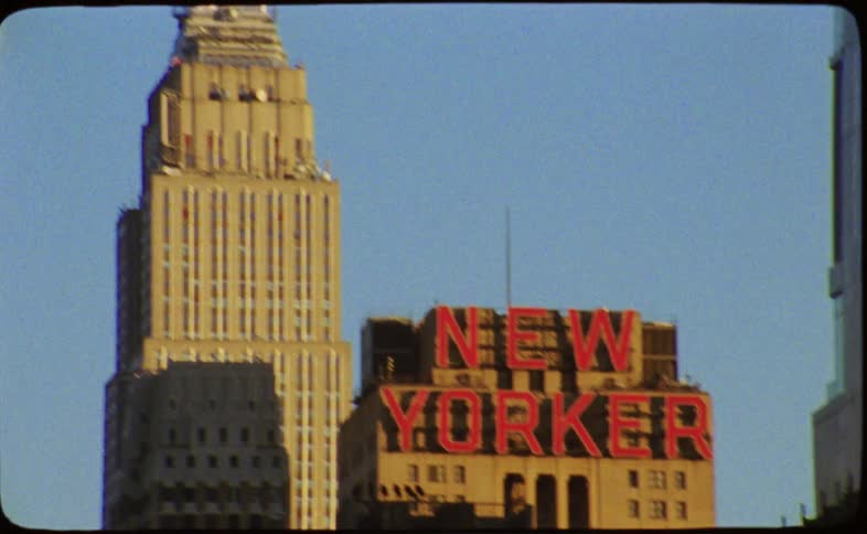 Vintage 8mm footage reveals the iconic New Yorker Hotel sign before panning up to the spire of the Empire State Building