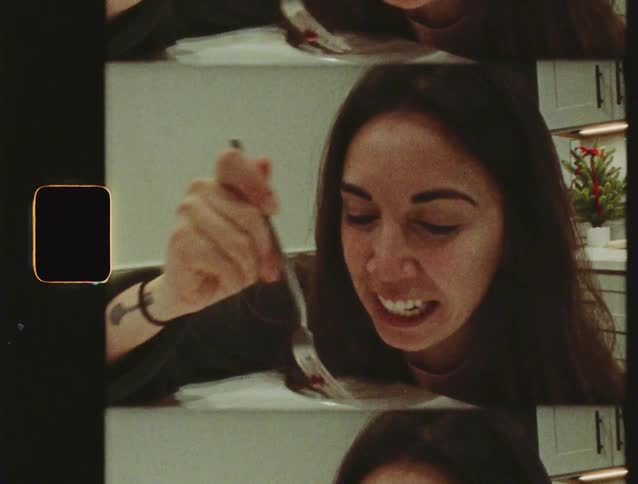 Vintage Super 8 film captures a woman in a multi-frame view as she happily eats a slice of cake in her kitchen
