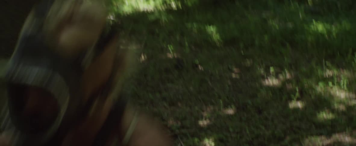 A woman runs through the forest
