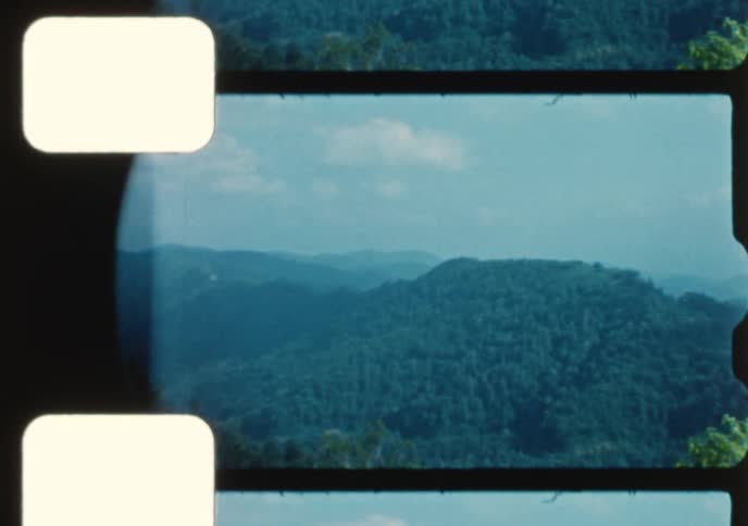 Vintage footage from the 1960s shows the entrance to Great Smoky Mountains National Park, scenic mountain views, and tourists exploring the area