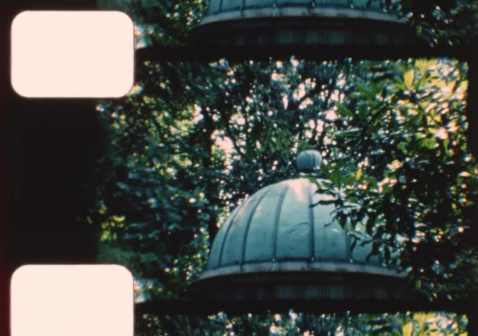 An archival home movie documents a tourist visit to Andrew Jackson's Hermitage, showing the grand mansion, grounds, and historic tomb