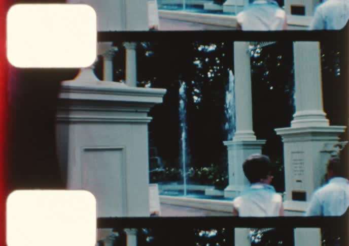 Vintage 8mm footage captures various scenes from a family's visit to a European-themed park in the 1960s
