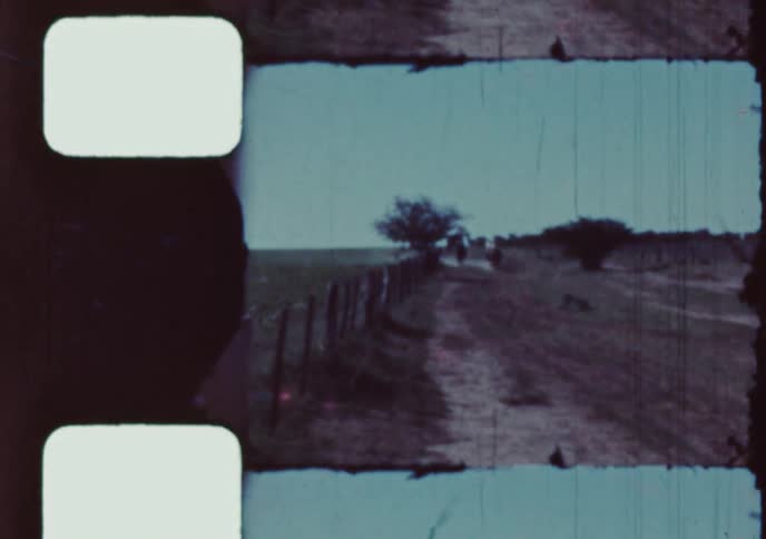 A group of young men on horseback race down a dusty country road in this authentic vintage 8mm home movie