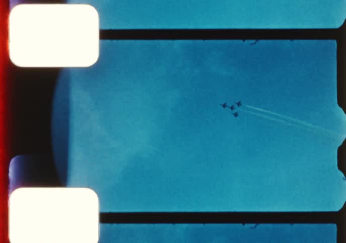 Archival 8mm film captures an exciting airshow featuring jets flying in perfect formation