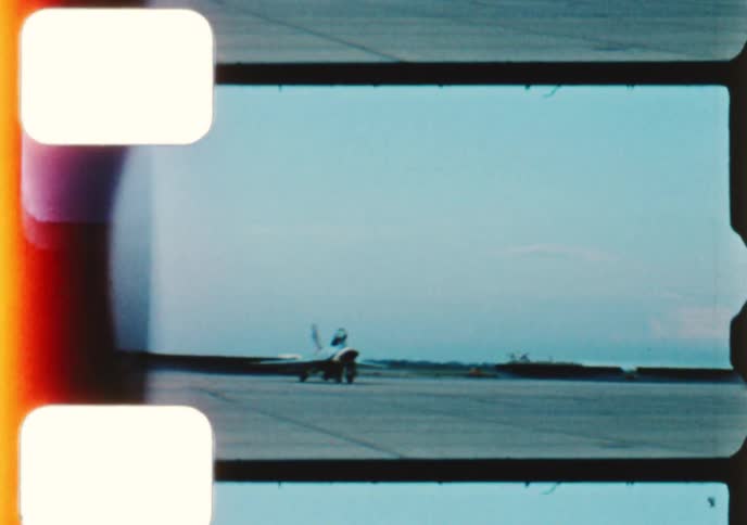 Vintage 8mm footage captures an exciting airshow with a squadron of jets performing synchronized aerial stunts and taxiing on the runway