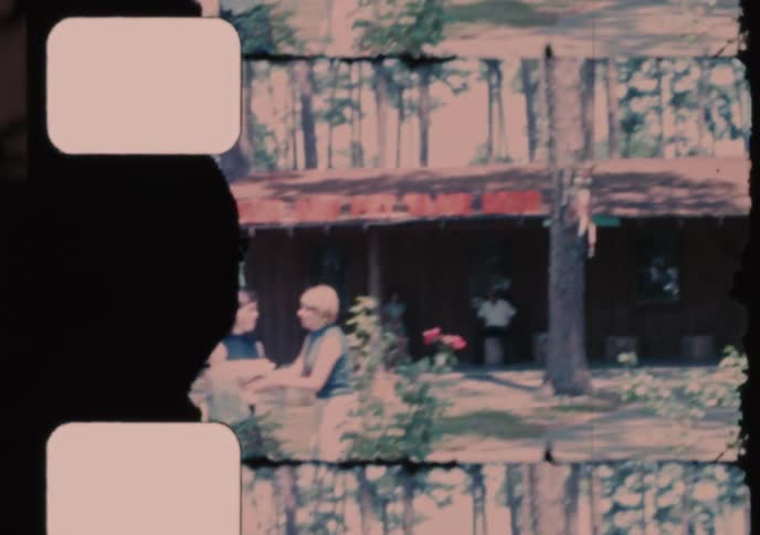 Vintage 8mm film captures a family visiting a roadside tame deer park in the 1960s