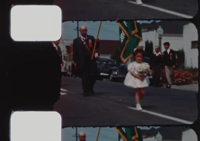 Vintage footage from the 1950s shows various groups marching in a parade in Hayward, California