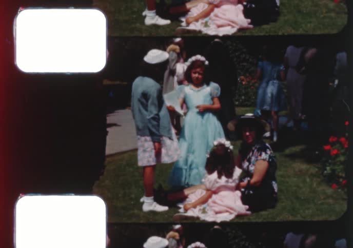 Vintage 8mm film strip of children celebrating a religious ceremony and a community parade in the 1950s
