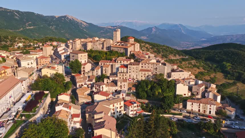 A stunning sunrise timelapse over the historic Italian mountain village of Pacentro, revealing the medieval castle and picturesque landscape