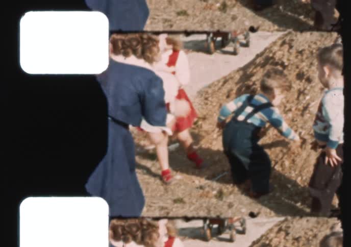 A vintage 8mm film strip shows an adorable toddler smiling for the camera before playfully interacting with other children in a backyard