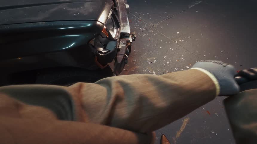 POV of a person in a suit violently smashing a car's headlight with a bloody baseball bat