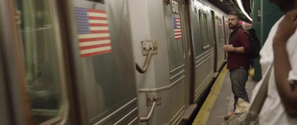 A subway car stopping a platform