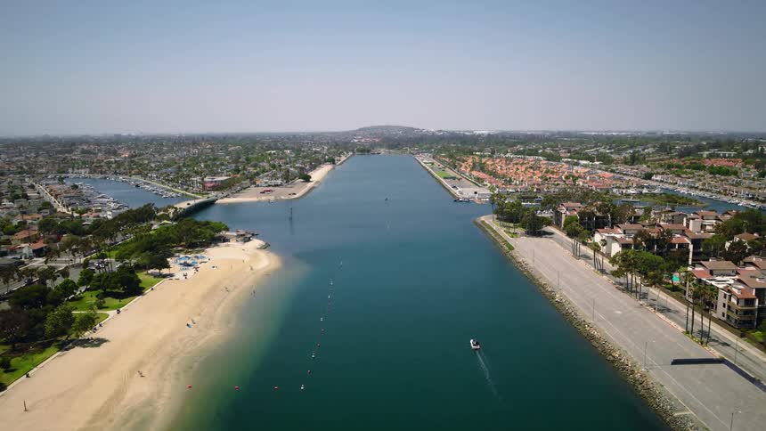 Aerial crane move and tilt down over Long Beach Marine Stadium Olympic rowing venue