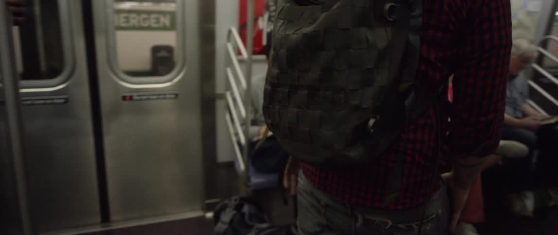 Man walking onto a subway train